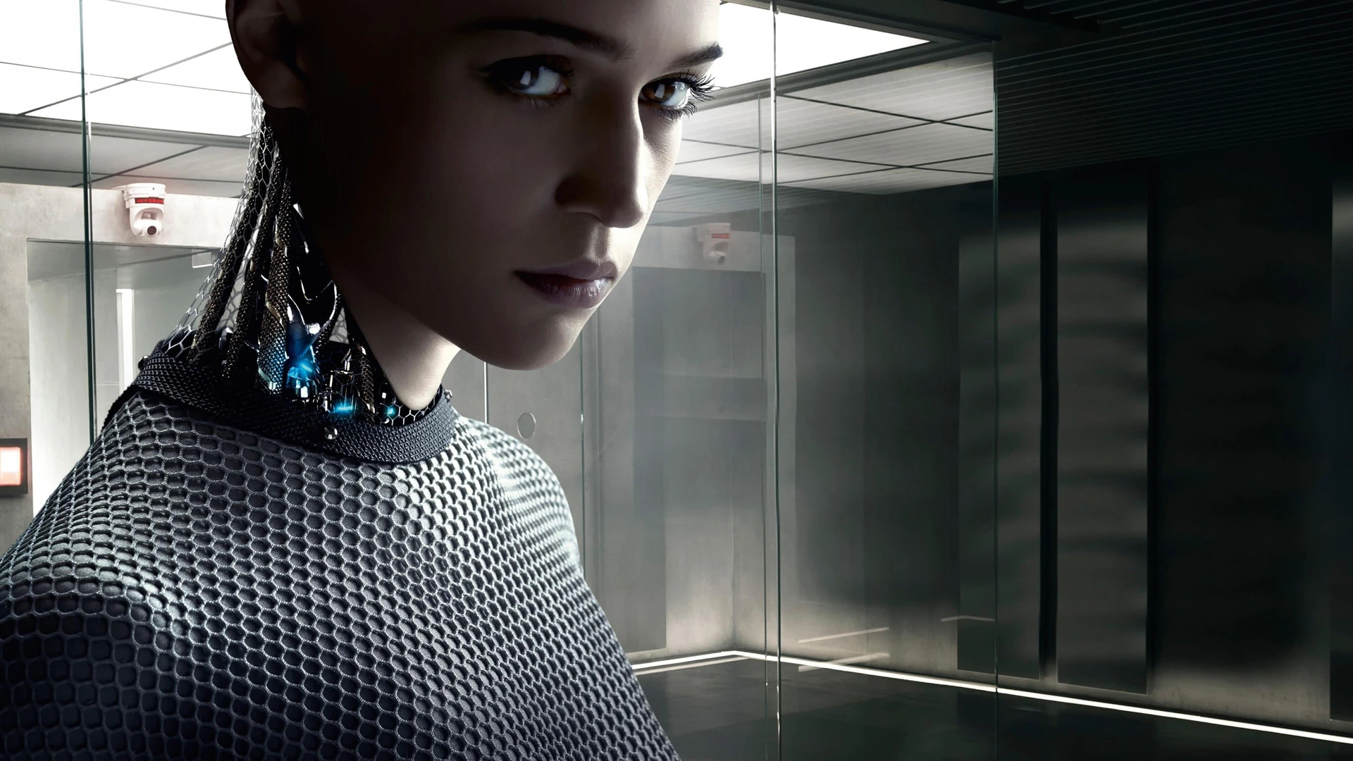 Ava, the AI, looks pensively into the distance in Ex Machina