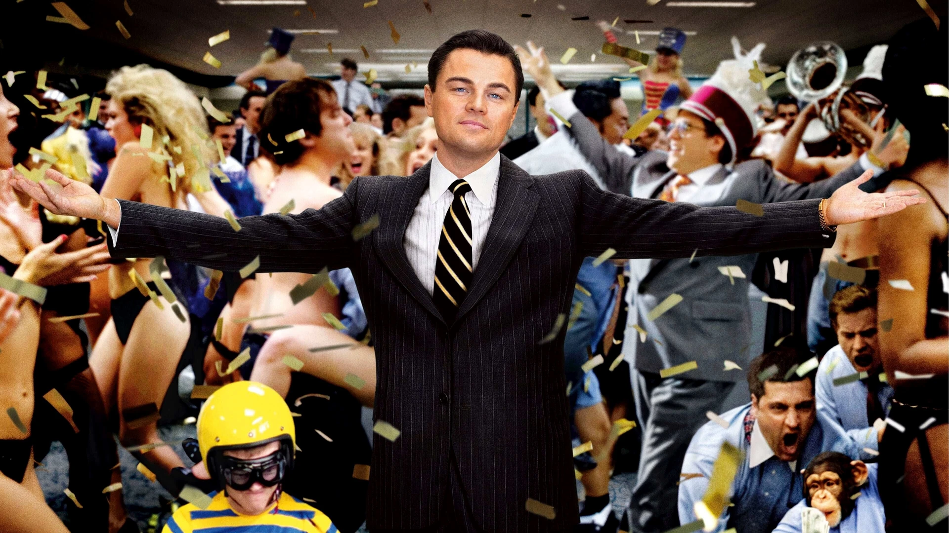 Leonardo DiCaprio as Jordan Belfort, mid-speech, commanding a crowd with an intense, almost maniacal grin