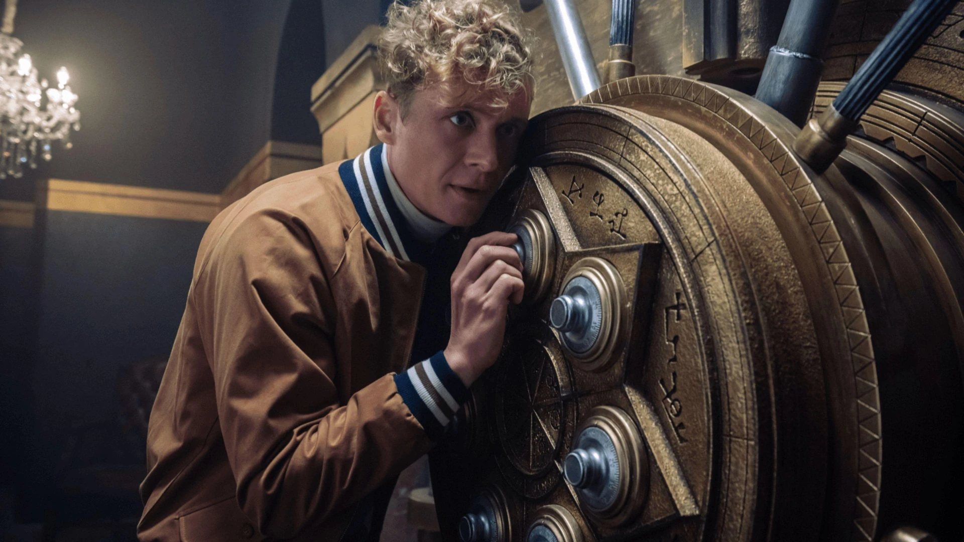 Ludwig Dieter, focused intently, listening to the intricate tumblers of a safe