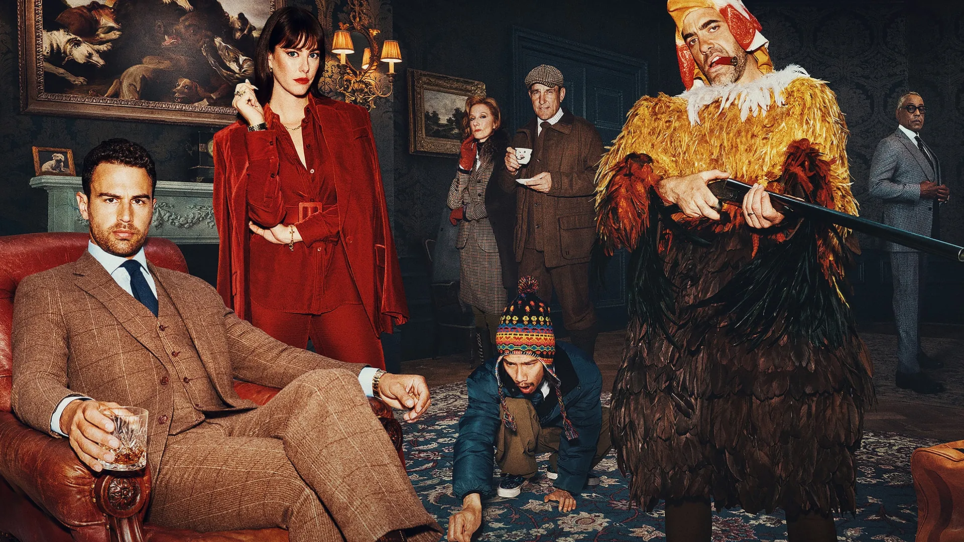 Theo James as Eddie Horniman, looking conflicted in a sharp suit amidst rural grandeur in The Gentlemen