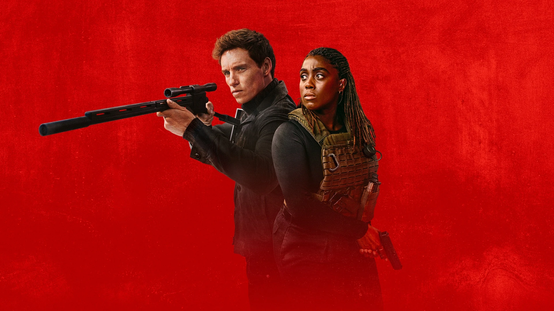 Eddie Redmayne as the Jackal, a lone assassin, in a tense, shadowy scene from the 2024 TV series.