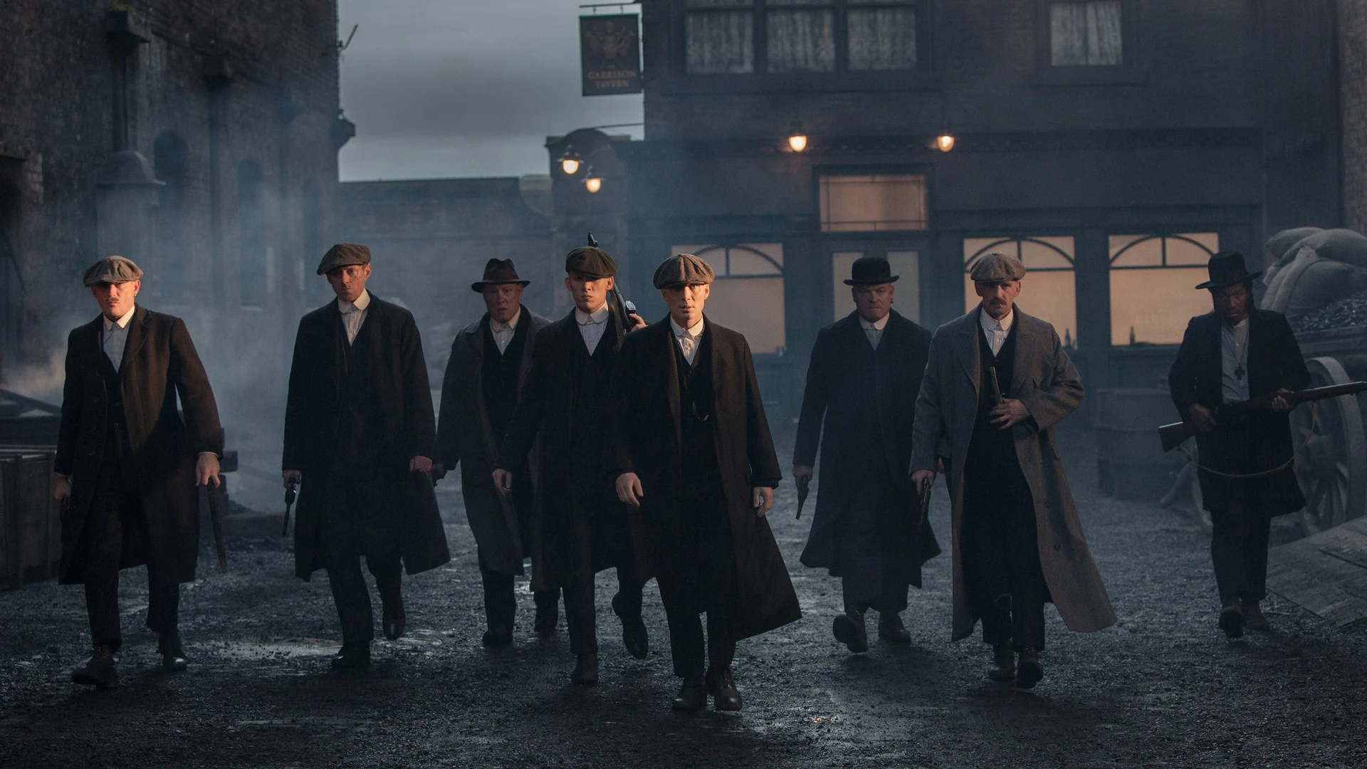 A brooding Tommy Shelby amidst the industrial backdrop of 1920s Birmingham