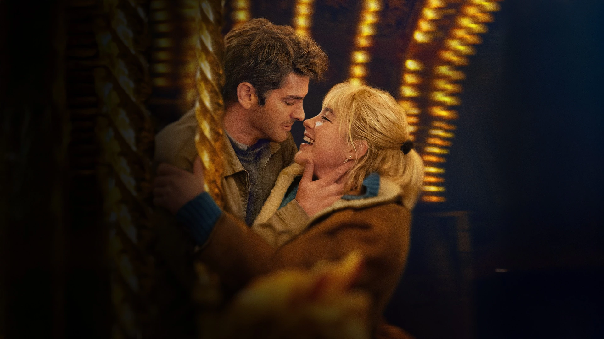Andrew Garfield and Florence Pugh gaze into each other's eyes, a moment suspended in time