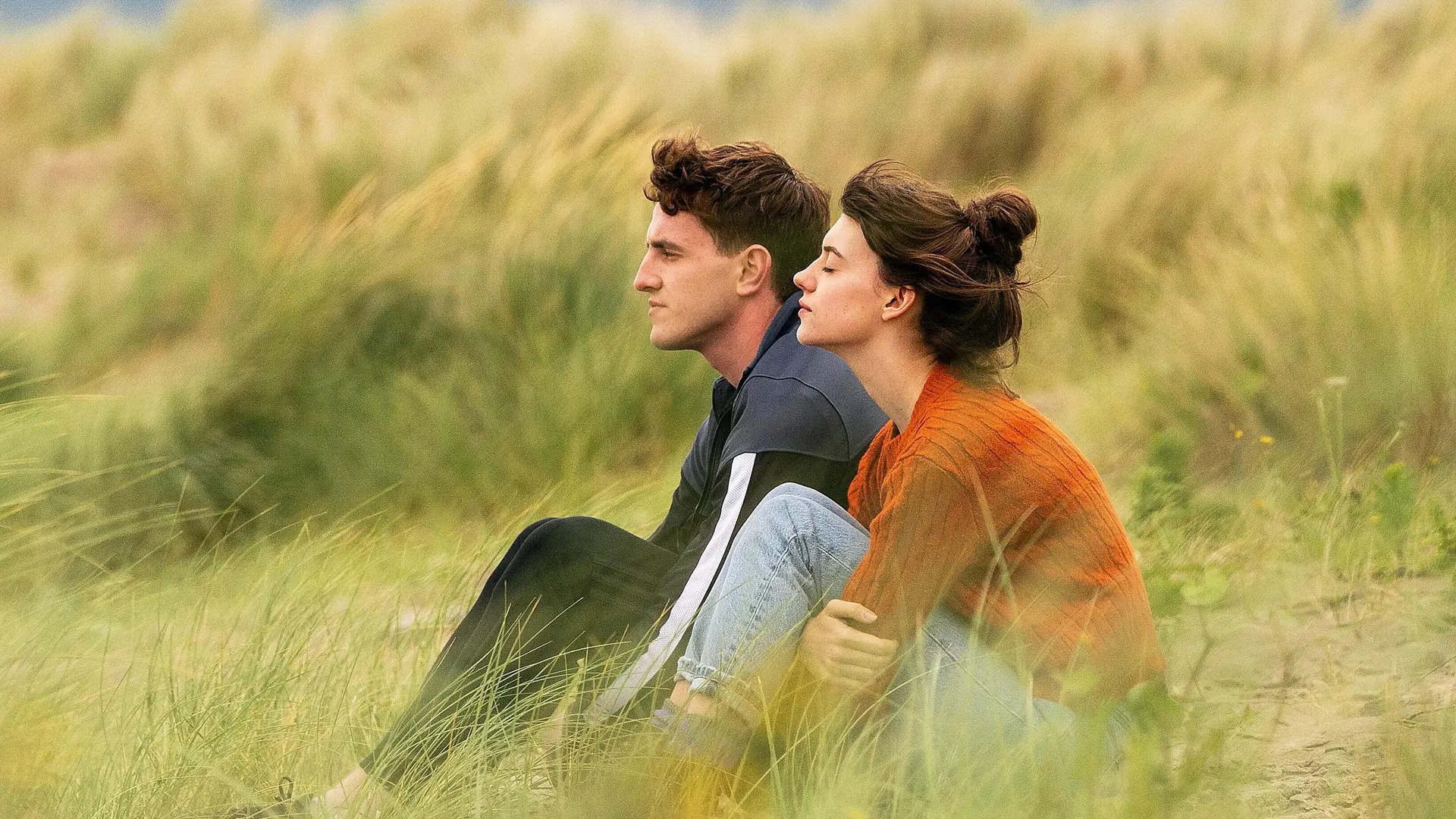 Marianne and Connell in a moment of quiet intimacy, looking away from each other