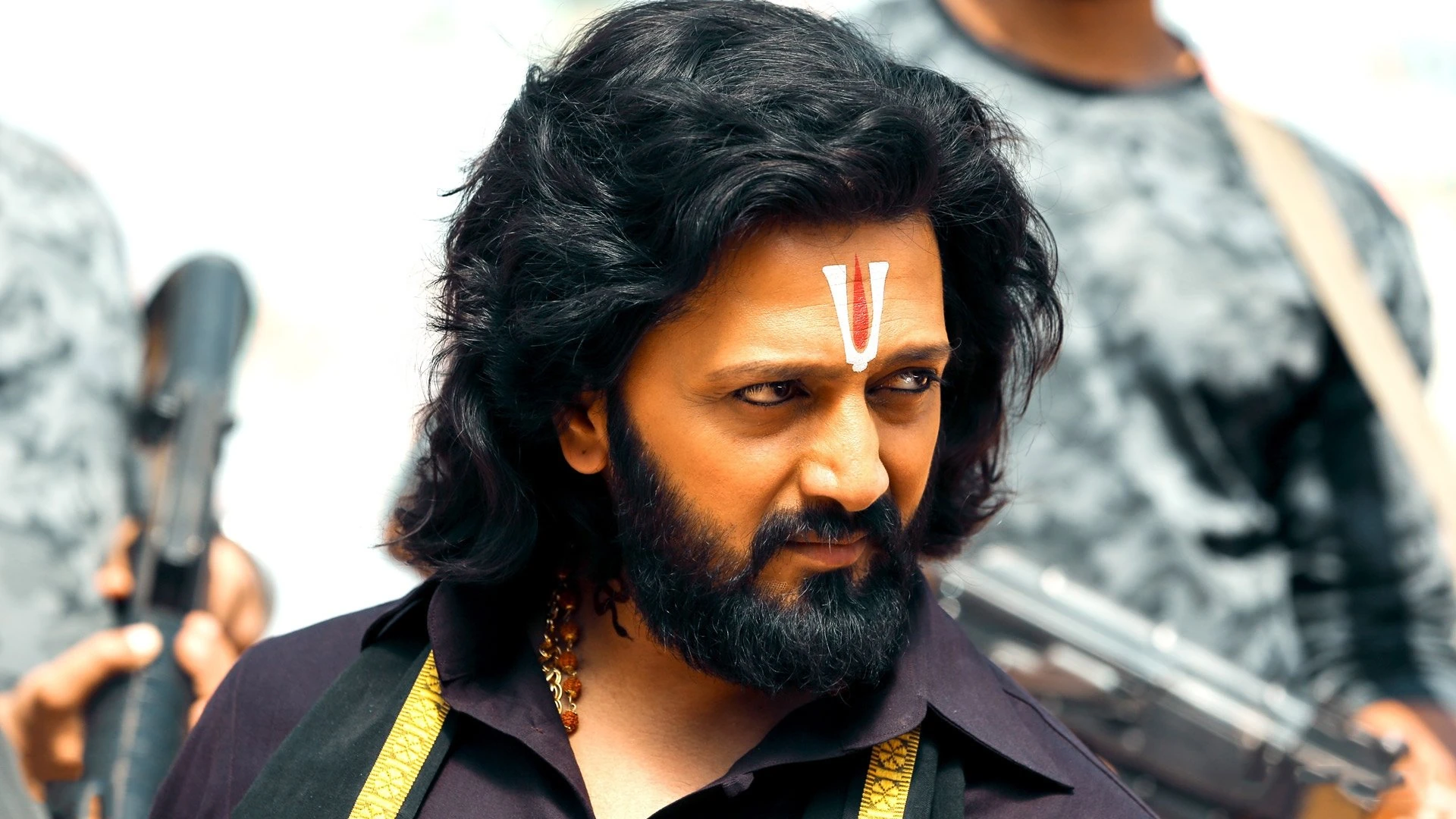 Sidharth Malhotra and Tara Sutaria in a poignant scene from Marjaavaan, bathed in dramatic lighting.